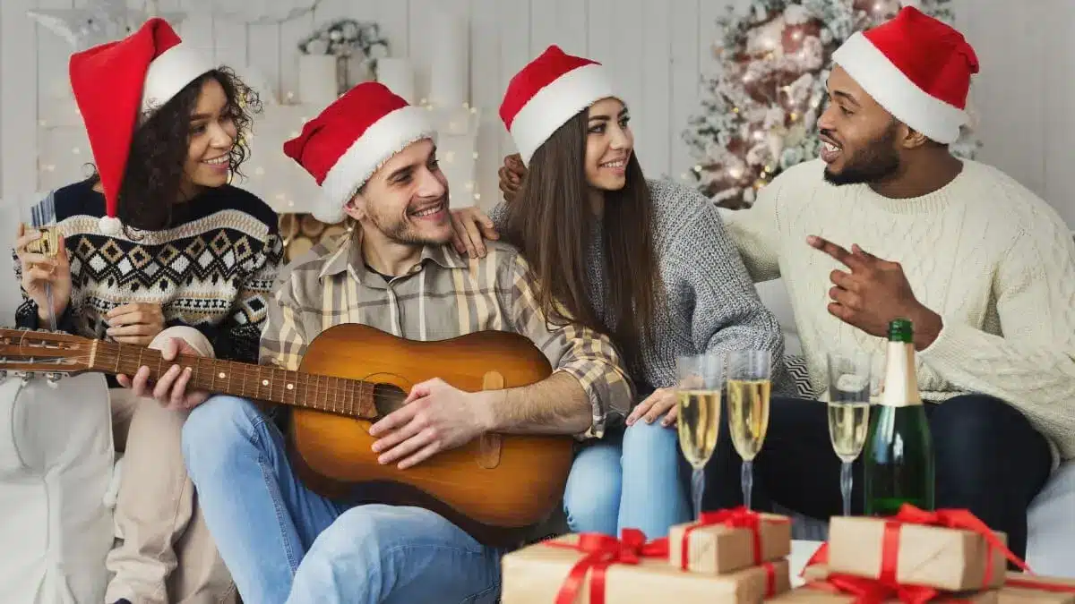 Friends wearing Santa hats enjoying a clean and festive home during a christmas cleaning checklist