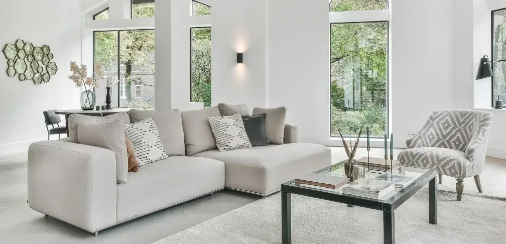 Peaceful and clean living room with natural light representing the stress relief provided by professional maid services